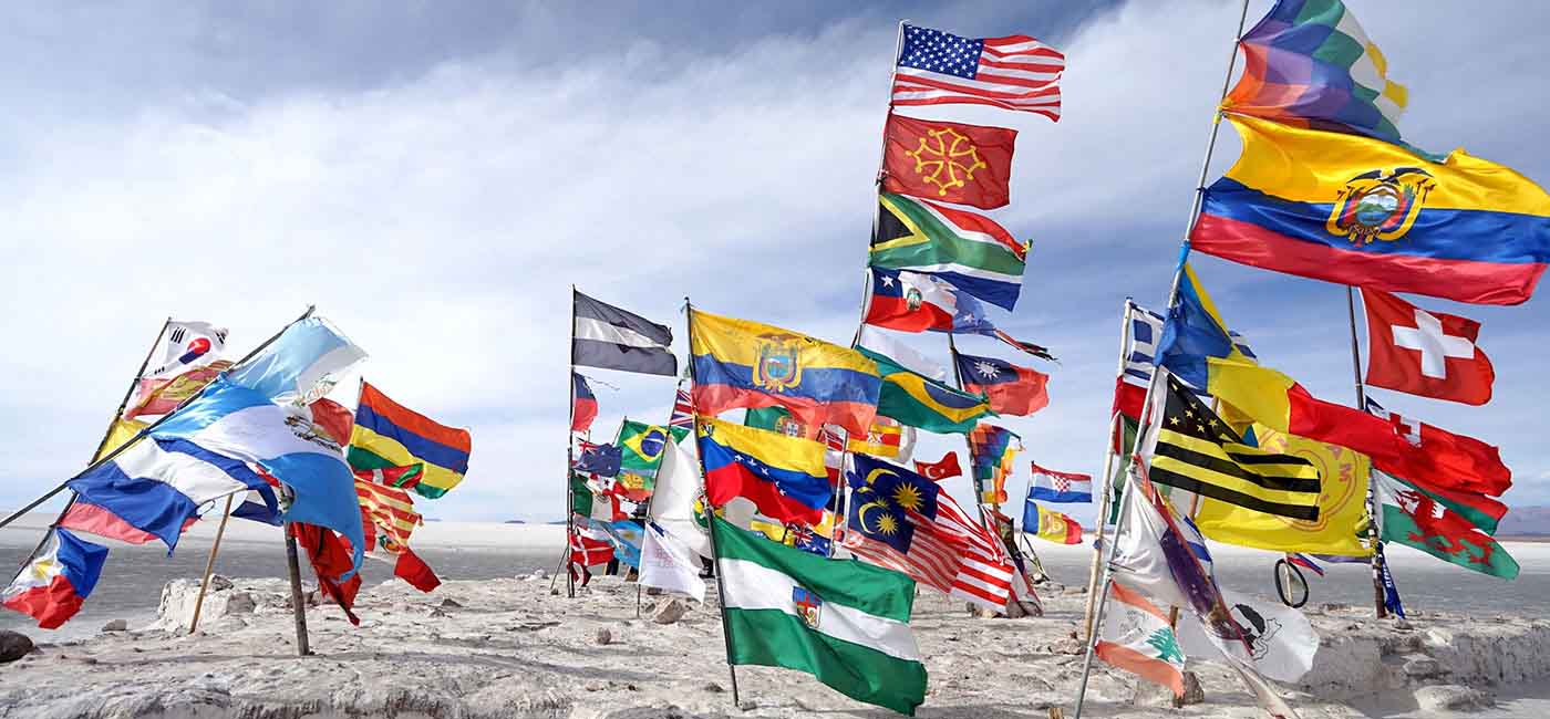 Multiple country flags blow in the windy desert!''