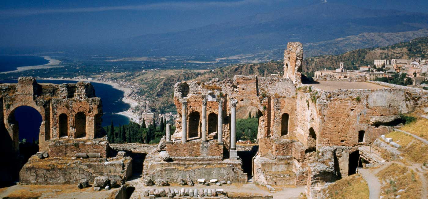 Ruins of a building on a hillside in Taormina, Sicily, Italy.!''